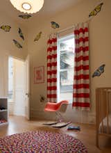 Butterflies and insects by Fnnch decorate the walls of one of the children's rooms.&nbsp;