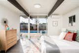 The master bedroom features sliding glass doors which provide direct access to the backyard pool.&nbsp;
