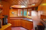 The angular galley kitchen is illuminated by a hexagonal skylight.&nbsp;