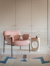 Key pieces in the Cozy Room include the pink Bollo armchair by Andreas Engesvik, a sculptural side table by Souda, and a muted geometric rug by Ferm Living.