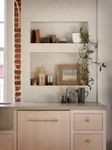 Built-in, tiled alcoves showcase work from ceramic artists Kati Von Lehman and Ank Ceramics.  