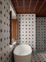 The bathroom interiors are a twist on a traditional pattern and are made from local materials. 