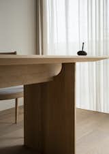 A negative space in this table’s joinery allows light to shine through.