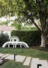 Jeppe Hein’s&nbsp; Modified Social Bench #28 stands the home’s front yard.&nbsp;