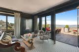 French doors open to a terrace with views of the San Francisco Bay.
