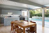 The dining area overlooks the pool.&nbsp;