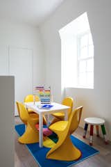 The children's play space has bold yellow Panton junior chairs. 