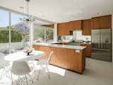 The kitchen has been updated with a vintage vibe and seamlessly integrates into the home's clean midcentury style.