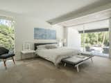 The master bedroom overlooks an outdoor patio and features expanses of glass and lots of natural light.&nbsp;