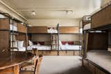 All the bunk beds feature privacy curtains and personal hanging storage bags from Revive Upholstery. 