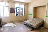 A former apartment bedroom before the renovation.  Photo 15 of 24 in Before & After: A Historic Apartment Building Is Transformed Into a Chic Social Hotel in Portland
