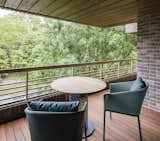 On the terrace, Kettal’s Mesh table and Bitta chairs provide a serene lounge area.&nbsp;