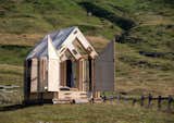 Birch plywood panels, full-height windows and a transparent roof compose "Immerso Glamping
