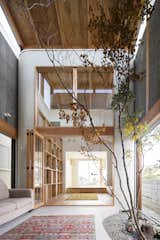 Satoshi Saito of SAI Architectural Design Office took the directive to heart when a young Osaka family requested a home in which they could "feel green." The indoor/outdoor residence essentially comprises two structures that are unified by a double-height, courtyard-like space with clerestory windows that usher in ample natural light.&nbsp; &nbsp;