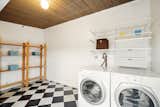 A designated laundry room opens to the outdoor space.