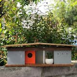This birdhouse inspired by Fairhaven, an Eichler subdivision.  Made with bamboo wood and high-end gray, white, and orange laminate, the birdhouse features four frosted glass windows and a low-profile roof.&nbsp;