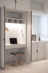 The entire unit is a custom design, fitted with drawers and a writable magnetic surface—just like a proper office.