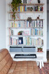 There is full-height shelving in the den. Photos by Isabel Parra