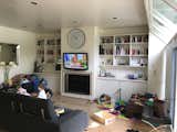 Living Room Lacking additional square footage, the living room had doubled as a playroom for the couple's boys.  Photo 16 of 38 in Before & After: A Victorian Cottage Expands With a Rear Addition to Accommodate a Growing Family
