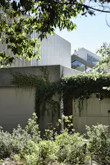The concrete gabels peek out from over the top of the garage.