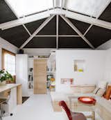 “This was a former painting workshop, so it has lots of light but no insulation. The roof structure was maintained as is, but we painted it white and covered it with dark natural cork,” shares de la Vega. The pine was all sourced locally from the north of Spain, and the door leads to the couple’s bedroom.