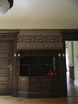 Before: The wood-paneled dining room with its stately fireplace and built-in cabinetry were preserved as part of the requirements laid out by the Historic Review Board.