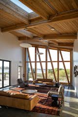 The high, angled ceiling and full-height windows provide perspective on the natural surroundings.&nbsp;