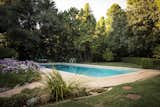 Set on almost an acre of land, the sprawling grounds include an in-ground swimming pool.&nbsp;