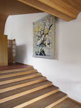 Saksi's woven work "Under Shelter II" adorns the staircase.&nbsp;&nbsp;