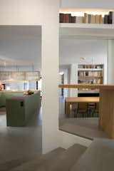 Stairs lead up to the main bedroom.   Photo 8 of 13 in A Crisp Athens Apartment Makes Room for a Family’s Home Brewery