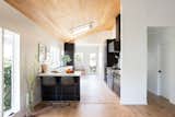 High ceilings and a skylight make the updated kitchen bright and airy.