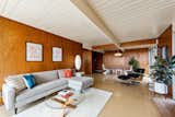 The tongue-and-groove ceiling of the well-appointed great room shows the home's post-and-beam construction.&nbsp;