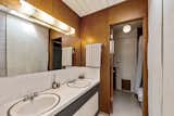 The shared second bathroom also has two vanities.&nbsp;