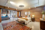 The ground-floor bedroom is clad in redwood and well lit from above.&nbsp;