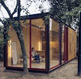 Using one of their existing prefab models, Madrid-based architects Delavegacanolasso created a custom work-from-home situation for a small business that wanted an office in the backyard. The 215-square-foot ADU features floor-to-ceiling windows and a Cor-Ten steel frame that allows the structure to blend with its natural surroundings.