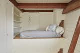 The second bedroom is tucked away in a loft-like alcove.