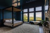 Floor-to-ceiling windows also span the home’s private spaces. Natural light and mountain views can be enjoyed from the bedrooms, soaking tubs, and even the walk-in closet.