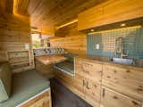 The signature red cedar interiors give Boho Camper Vans a tiny log cabin feel.&nbsp;