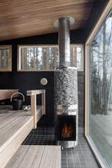 The wood-burning sauna stove is made by Finnish company IKI.