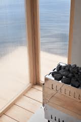 The prefab sauna provides guests with a cozy and intimate experience in a remarkable setting.