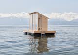 Löyly—the Finnish word for the steam rising from a sauna stove—is a floating prefab sauna made from Douglas fir. Here, it bobs in the middle of Lake Geneva, providing sauna-goers with a view over the water and the the Swiss Alps.