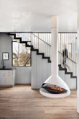 An Aidan single-sided suspension fireplace by VITA Fireplaces adds a cozy contemporary vibe.&nbsp;