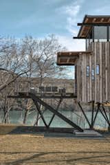 The reclaimed wood siding and timber beams mimic the owners’ main house on the adjacent property. "We wanted the tree house to feel special, while also keeping it relatable in color palette and materials to their main residence, since they are in close proximity and it will ultimately feel like one cohesive estate," explains project manager Jeremy Ristau.
