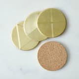Solid brass coasters sanded backed with cork, these hefty discs serve as an understated yet sharp-looking platform for your cocktails without damaging your table surfaces.