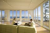 Folding glass NanaWall system in living room overlooking Atlantic Ocean