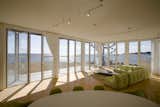 Folding glass NanaWall system in living room overlooking Atlantic Ocean