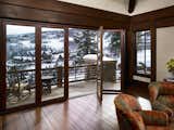 This rocky mountain respite enjoys views of its stunning surroundings all year-long with a little help from a WD66 opening glass wall. 