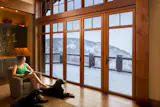 Our WA67 sliding glass wall creates the ideal enclosure for this cozy yet spacious mountain house in Park City.