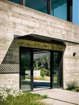 Exterior, House Building Type, Metal Roof Material, Concrete Siding Material, and Butterfly RoofLine  Photo 8 of 8 in The Butterfly House by NanaWall