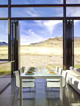 Just a few miles away from this Wapiti residence stands the iconic Grand Canyon. With opening glass walls present in almost every room, these homeowners enjoy the best of what desert views have to offer with tall NanaWall systems.
